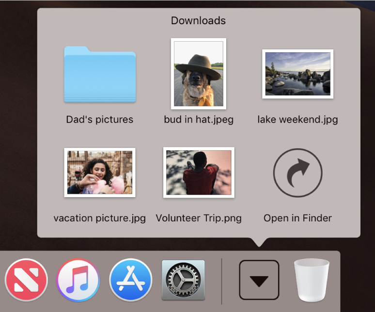 The Downloads stack in the Dock opened to show its contents in a grid.