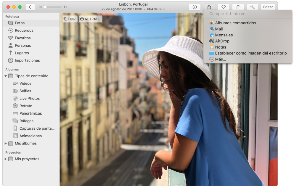 La ventana Fotos mostrando una foto y el menú Compartir con el comando Álbumes compartidos seleccionado.