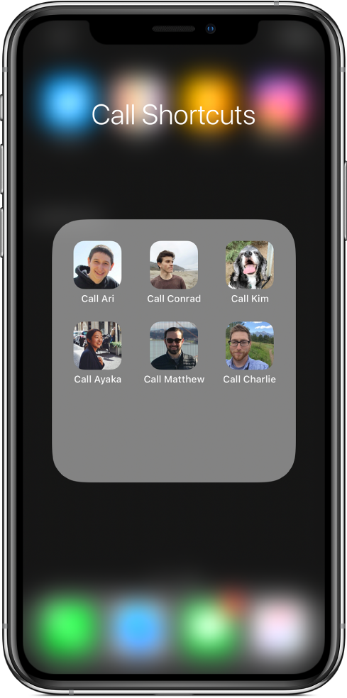 Atalhos de chamada na pasta "Ecrã principal" a mostrar imagens de contactos.