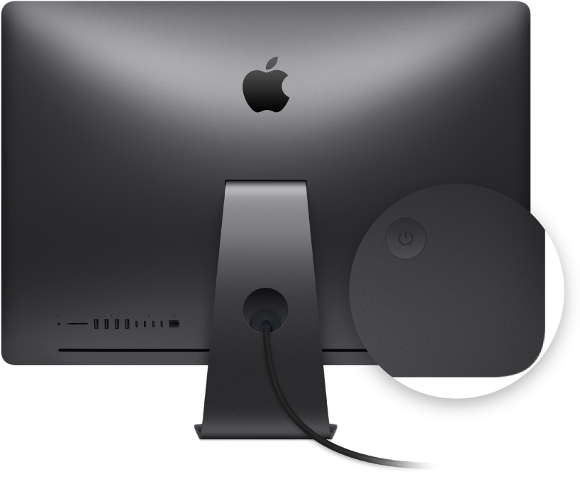 Näkymä iMac Pron näytön taustapuolelta, jossa näkyy virtapainike korostettuna.