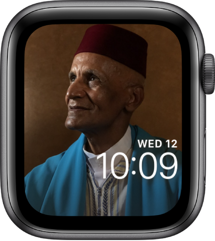 The Photos watch face shows a photo from your synced photo album. The face shows the date above the time.