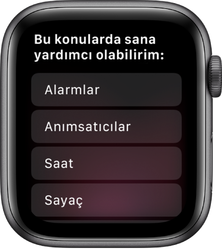 Örnekleri görmek için dokunabileceğiniz kaydırılabilen konu listesi ile “Size yardımcı olabileceğim bazı şeyler” ifadesini gösteren Apple Watch ekranı. Konulara Alarmlar, Anımsatıcılar ve Saat dahildir.