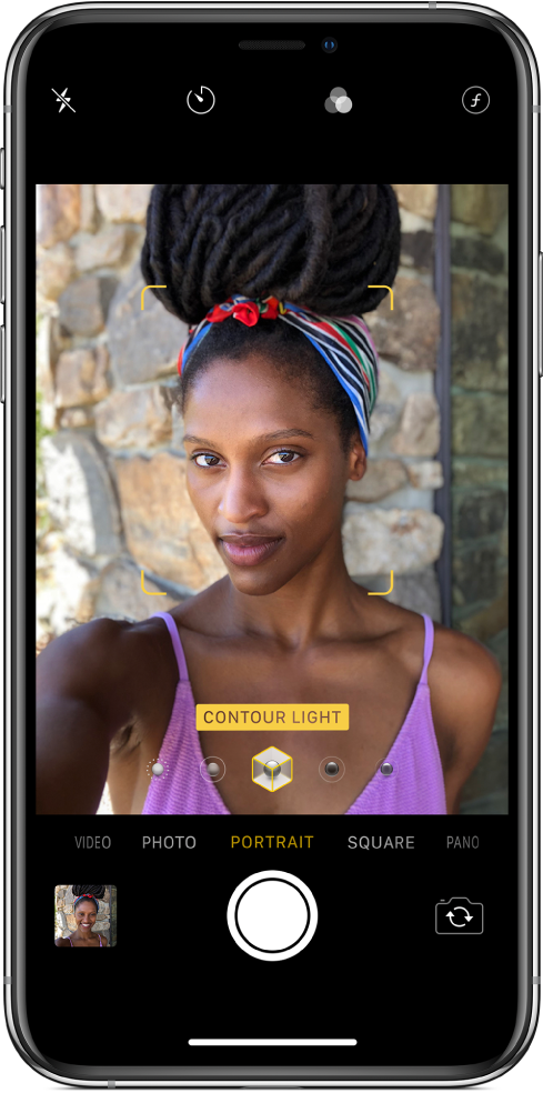 The Camera screen with Portrait mode selected. In the viewer, a box shows that the Portrait Lighting option is set to Contour Light, and there’s a slider to change the lighting.