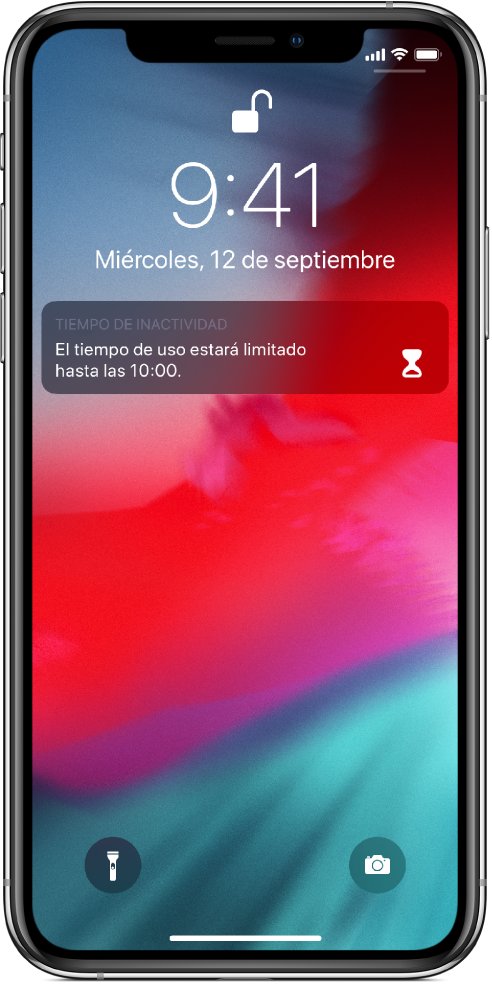 Pantalla bloqueada del iPhone con una notificación de “Tiempo de inactividad”, que indica que el tiempo de uso está limitado hasta las 10 de la mañana.