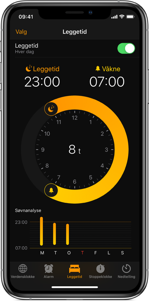 Leggetid-knappen er valgt i Klokke-appen og viser at leggetiden starter klokken 23, og vekketiden er satt til klokken 7 om morgenen.