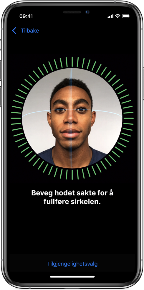 Konfigureringsskjermen for Face ID-gjenkjenning. Et ansikt vises på skjermen, omsluttet av en sirkel. Teksten under ber deg om å bevege hodet sakte for å fullføre sirkelen.