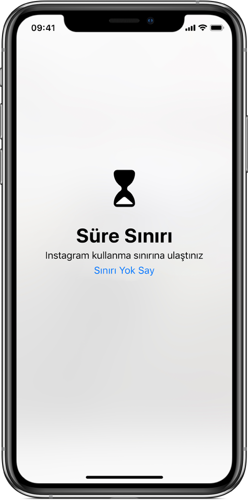 Bugün Instagram’da bir saat harcandığını belirten bir Süre Sınırı uyarısını gösteren ekran. Uyarının altında Sınırı Yok Say düğmesi var.