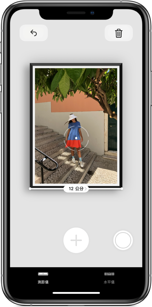 測量中的相框，底部邊緣顯示其寬度。「拍照」按鈕位於右下角。