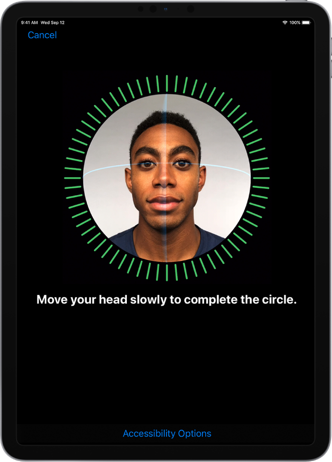 The Face ID recognition setup screen. A face is showing on the screen, enclosed in a circle. Text below that instructs you to move your head slowly to complete the circle.