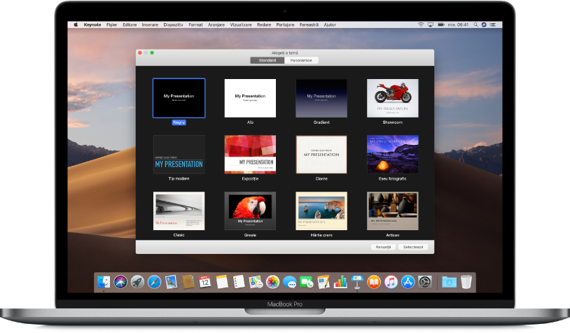 Un MacBook Pro cu selectorul de teme Keynote deschis pe ecran, cu butoanele în partea de sus pentru Standard și Lat. Este selectată opțiunea Standard și imaginile în miniatură ale șabloanelor apar dedesubt.