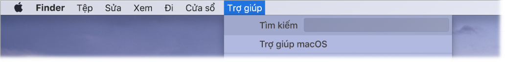 Một phần của màn hình nền với menu Trợ giúp được mở, đang hiển thị các tùy chọn menu Tìm kiếm và Trợ giúp macOS.