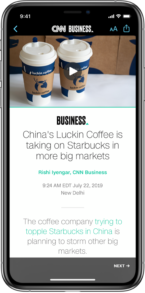 An article from Apple News. At the top-left of the screen is the Back button to return to the Stocks app. At the top-right corner of the screen are the Text Format and Share buttons. At the bottom-right corner is the Next Page button.