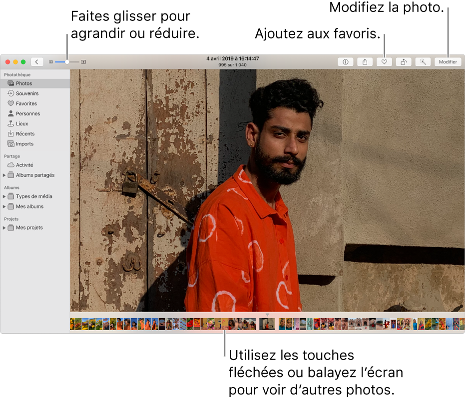 La fenêtre Photos présentant une photo agrandie à droite avec un rang de vignettes au-dessous. La barre d’outils en haut comprend le curseur Réduire/agrandir, le bouton Ajouter aux favoris et le bouton Modifier.