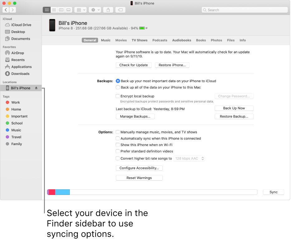 A device selected in the Finder sidebar and syncing options appearing in the window.