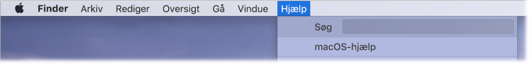 En del af et skrivebord med en åben Hjælpemenu, der viser menukommandoer som Søg og macOS-hjælp.