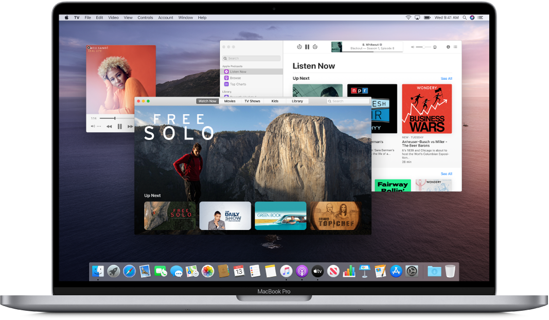 A MacBook Pro desktop showing the Music, TV, and Podcasts windows open.