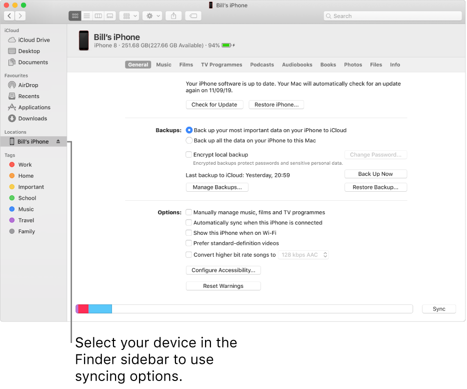 A device selected in the Finder sidebar and syncing options appearing in the window.
