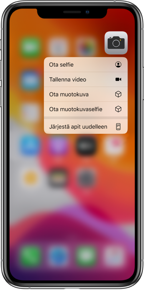 Koti-valikko sumennettuna. Kamera-apin alla näkyy kameran pikatoimintovalikko.