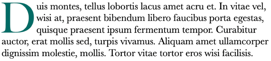 Un esempio di capolettera che mostra un paragrafo che inizia con una grande lettera verde D.