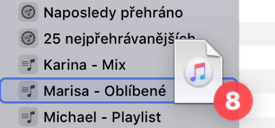 Přetažení alba do playlistu. Playlist je označený modrým trojúhelníčkem