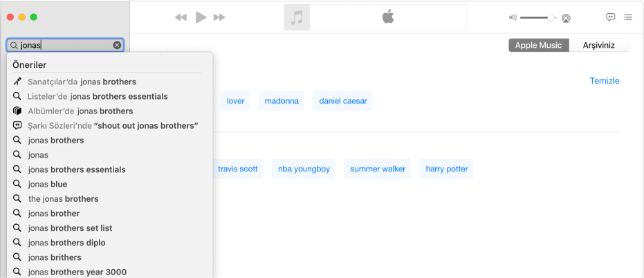 Sağ üst köşede seçili Apple Music ve sol üst köşede arama alanına girilmiş “Jonas” ifadesini gösteren Müzik ekranı. “Jonas” için önerilen Apple Music sonuçları, arama alanının altındaki listede görüntülenir.