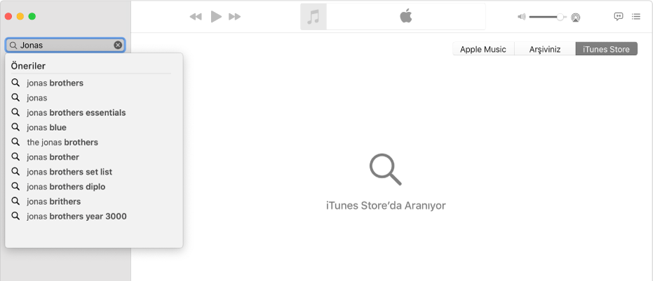 Sağ üst köşede seçili iTunes Store ve sol üst köşede arama alanına girilmiş "Jonas" ifadesini gösteren Müzik penceresi. “Jonas” için önerilen iTunes Store sonuçları, arama alanının altındaki listede görüntülenir.