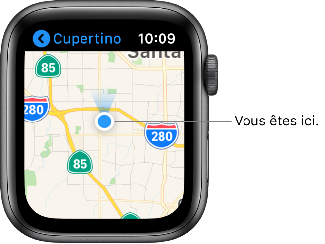L’app Plans affichant un plan. Votre emplacement est indiqué à l’aide d’un point bleu sur le plan. Au-dessus du point de position se trouve un cône bleu indiquant que l’Apple Watch est orientée vers le nord.