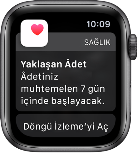 Şu yazının bulunduğu bir döngü tahmini ekranını gösteren Apple Watch: “Yaklaşan Âdet. Âdetiniz 7 gün içinde başlayabilir.” Döngü İzleme’yi Aç düğmesi en altta görünür.
