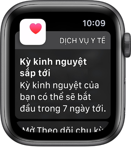 Apple Watch đang hiển thị một màn hình dự đoán chu kỳ có nội dung: “Kỳ kinh nguyệt sắp tới. Kỳ kinh nguyệt của bạn có thể sẽ bắt đầu trong 7 ngày tới”. Một nút Mở Theo dõi chu kỳ xuất hiện ở dưới cùng.