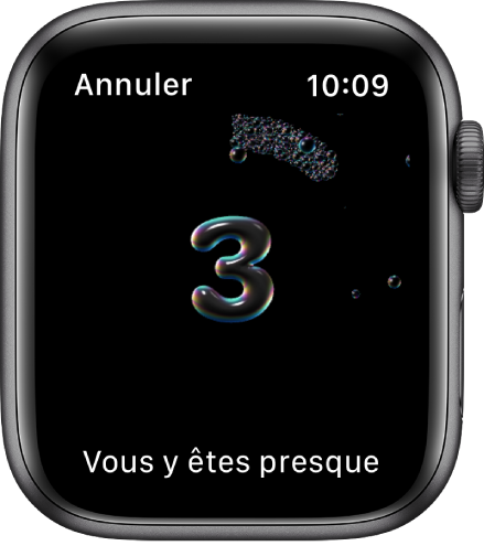 L’écran « Se laver les mains » qui affiche un compte à rebours à partir de trois. Les mots « Vous y êtes presque » s’affichent dans le bas.