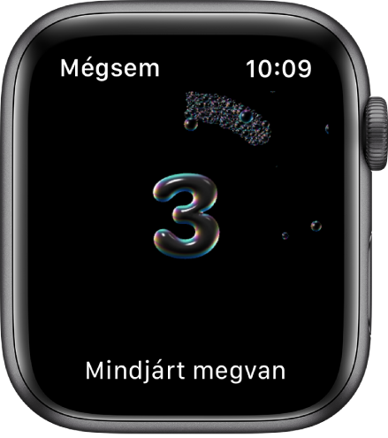 A Kézmosás funkció képernyője, amely visszaszámol 3-tól. Alul a „Mindjárt megvan" felirat olvasható.