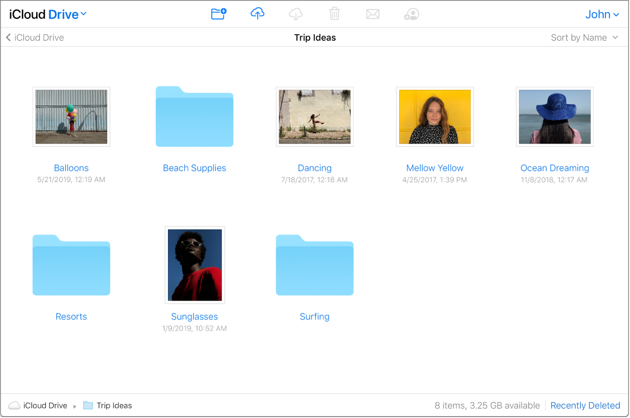 Uma pasta do iCloud Drive intitulada "Ideias de viagem" contém fotos e subpastas.