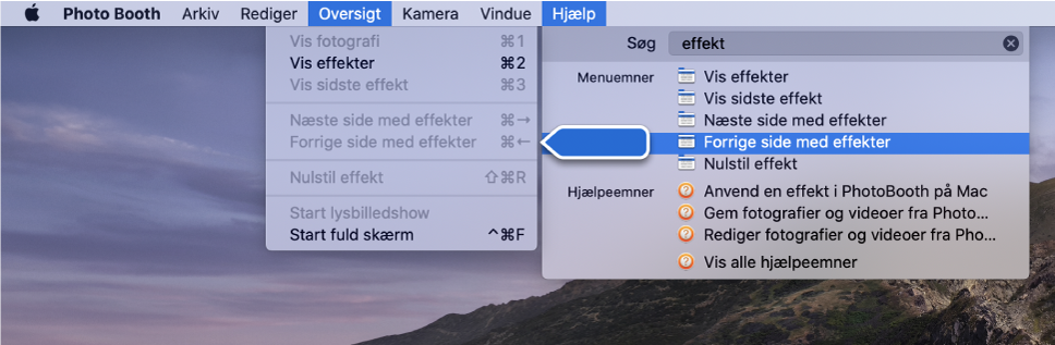Menuen Hjælp til Photo Booth med et søgeresultat for et menupunkt valgt og en pil, der peger på punktet i programmenuerne.