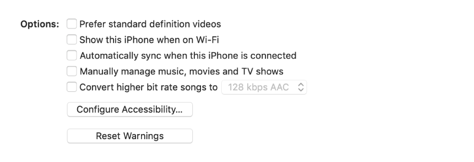 The sync options showing tick boxes to manually manage content items, automatically sync and display the device when connected over Wi-Fi. The “Prefer standard definition videos” and “Convert high bit rate songs to” options also appear. A Configure Accessibility button and a Reset Warning button also appear.