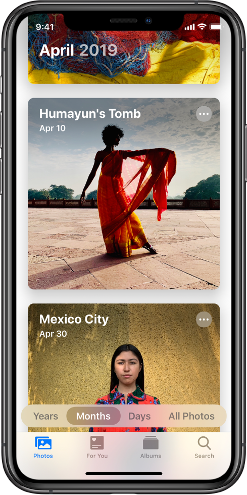 Екран в приложението Photos (Снимки). Избрани са етикет Photos (Снимки) и преглед Months (Месец). Показани са две събития от месец април 2019—Humayan’s Tomb и Mexico City.