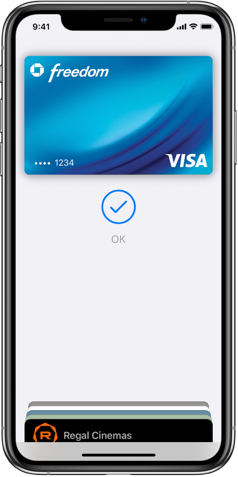 Una tarjeta de crédito en la pantalla Wallet. Debajo de la tarjeta, aparece una marca de verificación y la palabra OK.