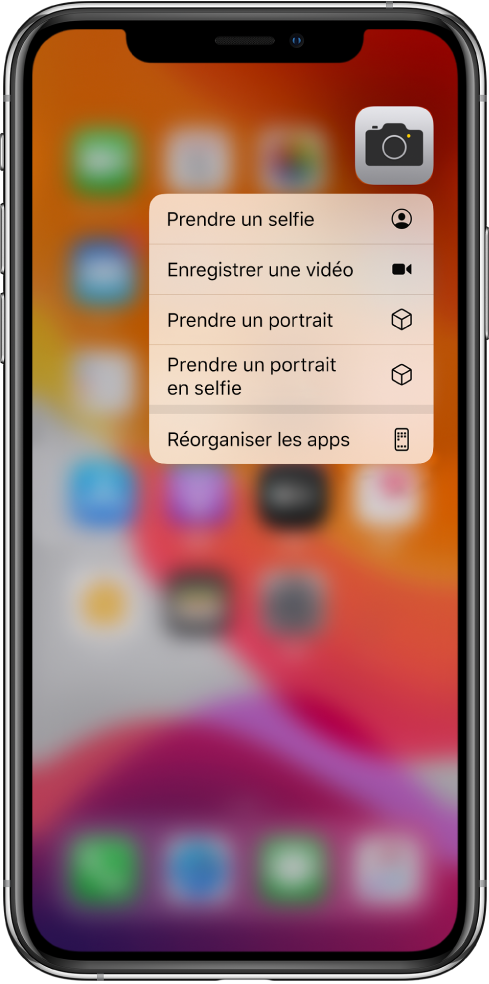 L’écran d’accueil flouté, avec le menu des actions rapides de l’appareil photo s’affichant sous l’app Appareil photo.