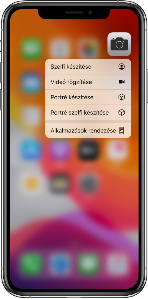 Az elhomályosított Főképernyő a Kamera gyorsműveletmenüvel, amely a Kamera alkalmazás alatt látható.