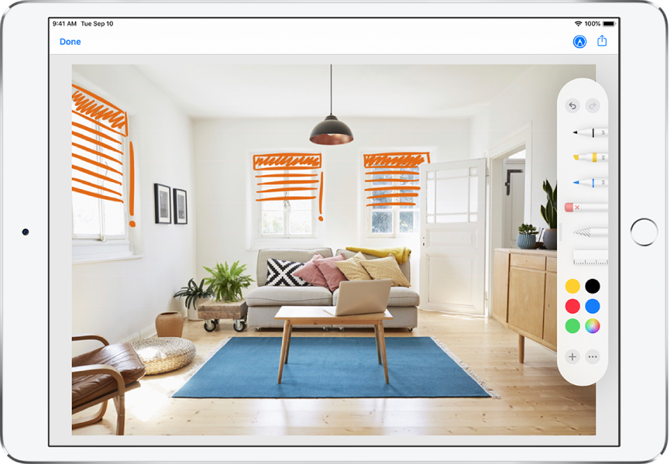 A photo is marked up with orange lines to indicate window blinds over windows. Drawing tools and color selections appear along the right edge of the screen.