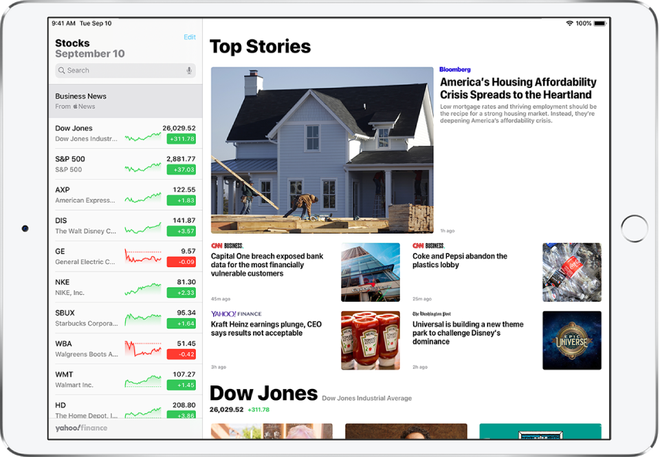 The Stocks screen in landscape orientation. The search field is in the top-left corner. Below the search field is the watchlist. Top Stories related to stocks in the watchlist fill the rest of the screen.