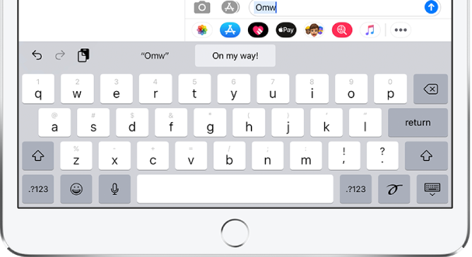 A message with the text shortcut OMW typed in the text field and “On my way!” suggested below as replacement text.