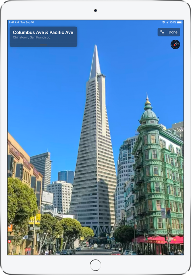 A full-screen view of a street leading to the Transamerica Pyramid building.