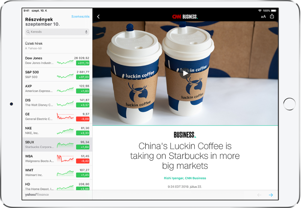 A Részvények alkalmazás képernyője vízszintes helyzetben. A bal felső sarokban a keresőmező látható. A cikk bal felső részén egy Vissza gomb található, amellyel visszatérhet a Részvények alkalmazáshoz. A cikk jobb felső sarkában a Szövegformátum és a Megosztás gomb látható. A jobb alsó sarokban a Következő oldal gomb jelenik meg.