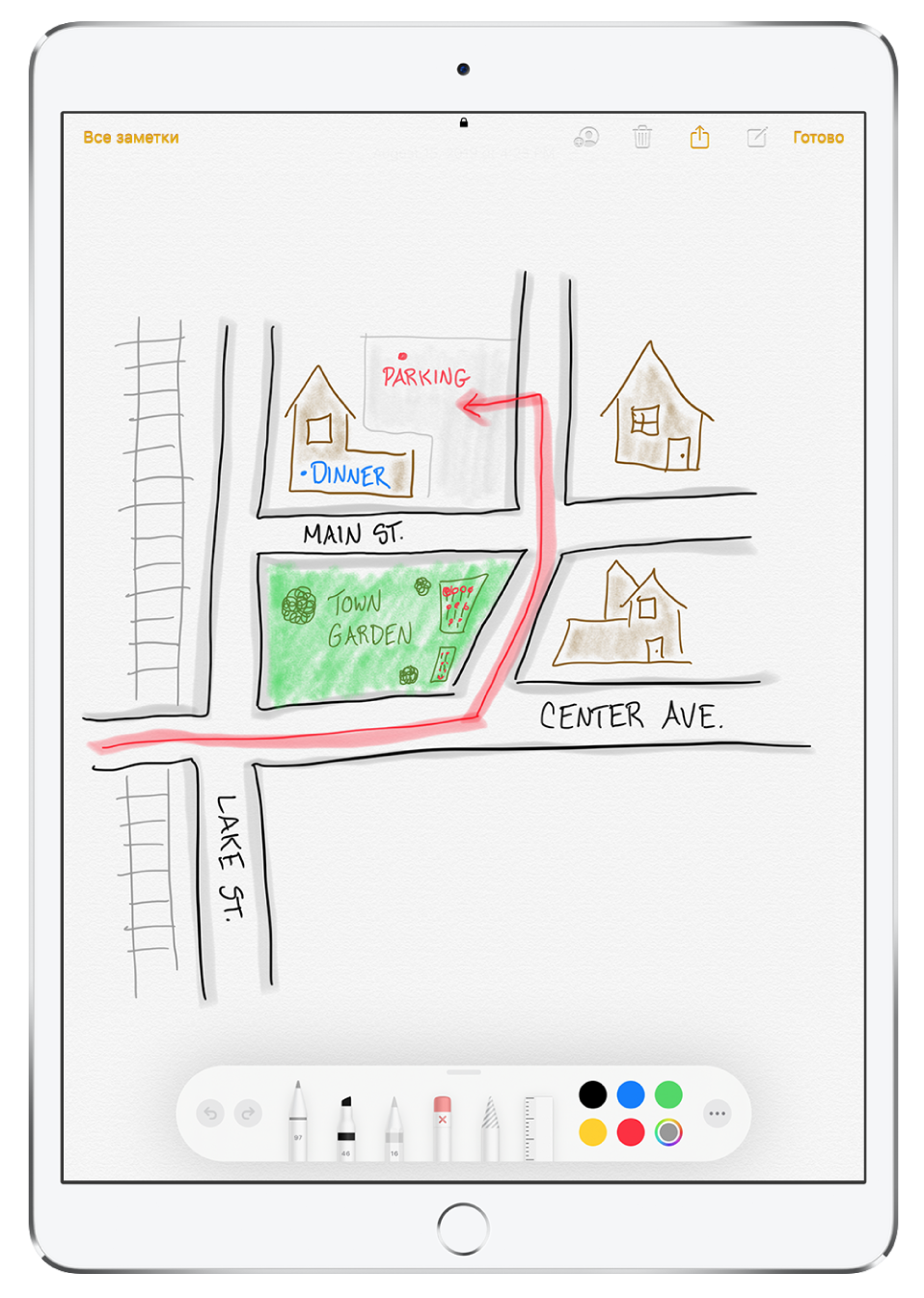 Экран приложения «Заметки». В заметку вложен рисунок, на котором изображен небольшой район. На рисунке — подписанные улицы и красная стрелка, указывающая на парковку. Вдоль нижнего края экрана расположена панель инструментов разметки, в которой выбран инструмент ввода текста и цвет.