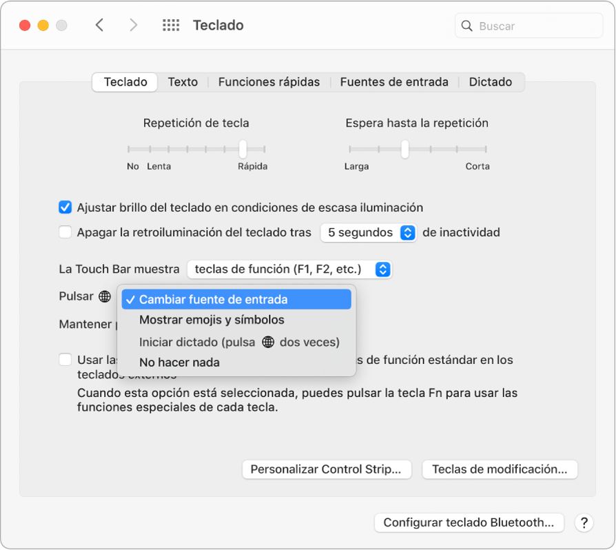 El panel de preferencias Teclado con un menú desplegable que muestra las opciones de la tecla de función (Fn)/globo terráqueo: “Cambiar fuente de entrada”, “Mostrar emojis y símbolos”, “Iniciar dictado” o “No hacer nada”.