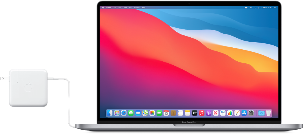 Güç adaptörü bağlı olan bir MacBook Pro.