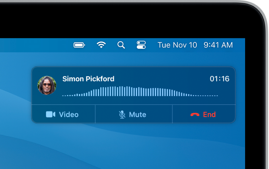 A notification appears in the top-right corner of the Mac screen, showing that a phone call is in progress.