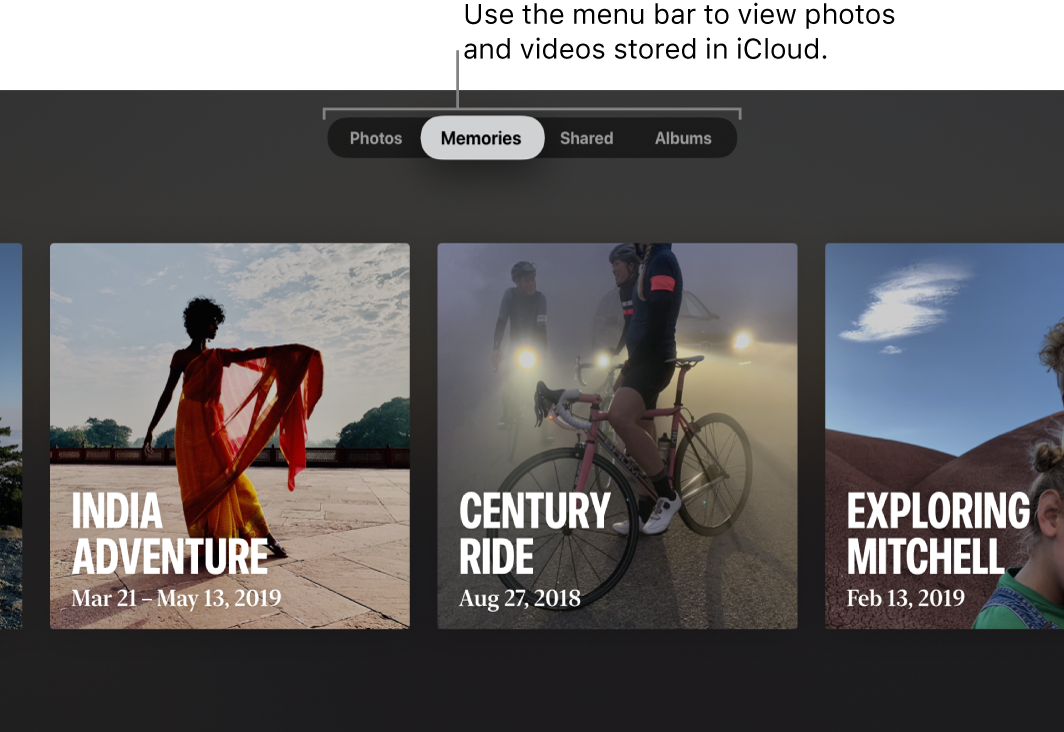 The Photos app on an Apple TV. A line points to the menu bar, showing four options: Photos, Memories (selected), Shared, and Albums. The callout says: “Use the menu bar to view photos and videos stored in iCloud.” Three Memories are visible: India Adventure, Century Ride, and Exploring Mitchell.
