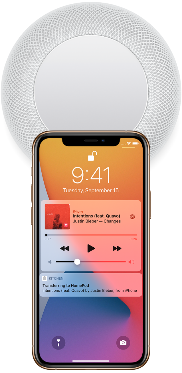 On an iPhone’s screen, a song is playing. The iPhone is close to the top of HomePod, and an alert says that the song is transferring to HomePod.