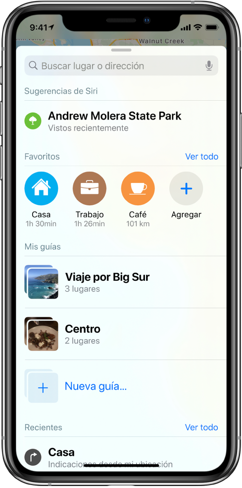 La tarjeta de búsqueda llena la pantalla. La sección de “Mis guías” aparece debajo de la fila de Favoritos. En la sección de “Mis guías” se muestran guías llamadas “Viaje por Big Sur” y “Centro”, así como una opción para crear una nueva guía.